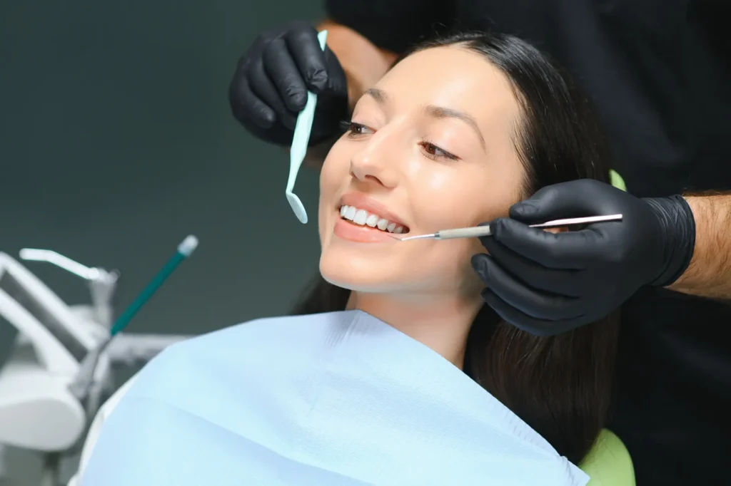 Doctor examining patient's teeth,